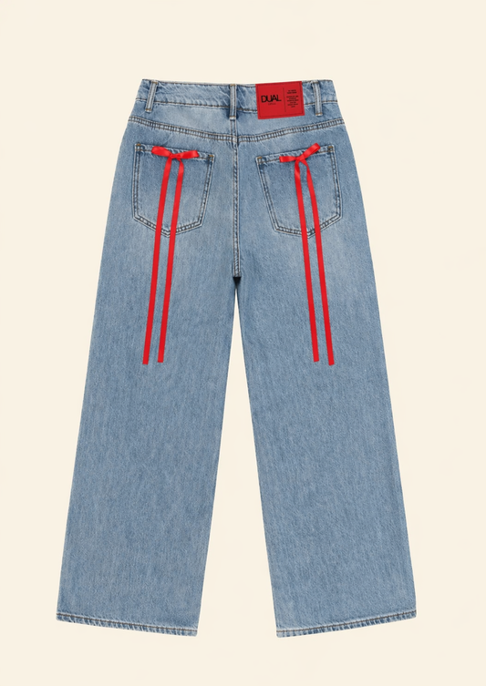 PANTALONI JEANS CON FIOCCHI ROSSI