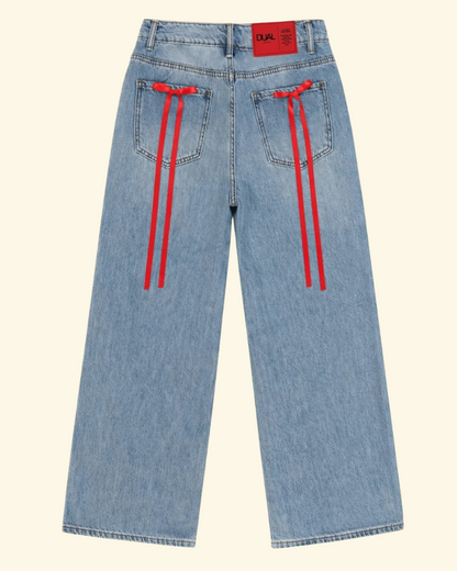 pantaloni jeans con fiocchi rossi