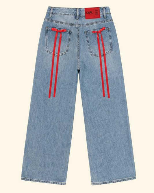 pantaloni jeans con fiocchi rossi