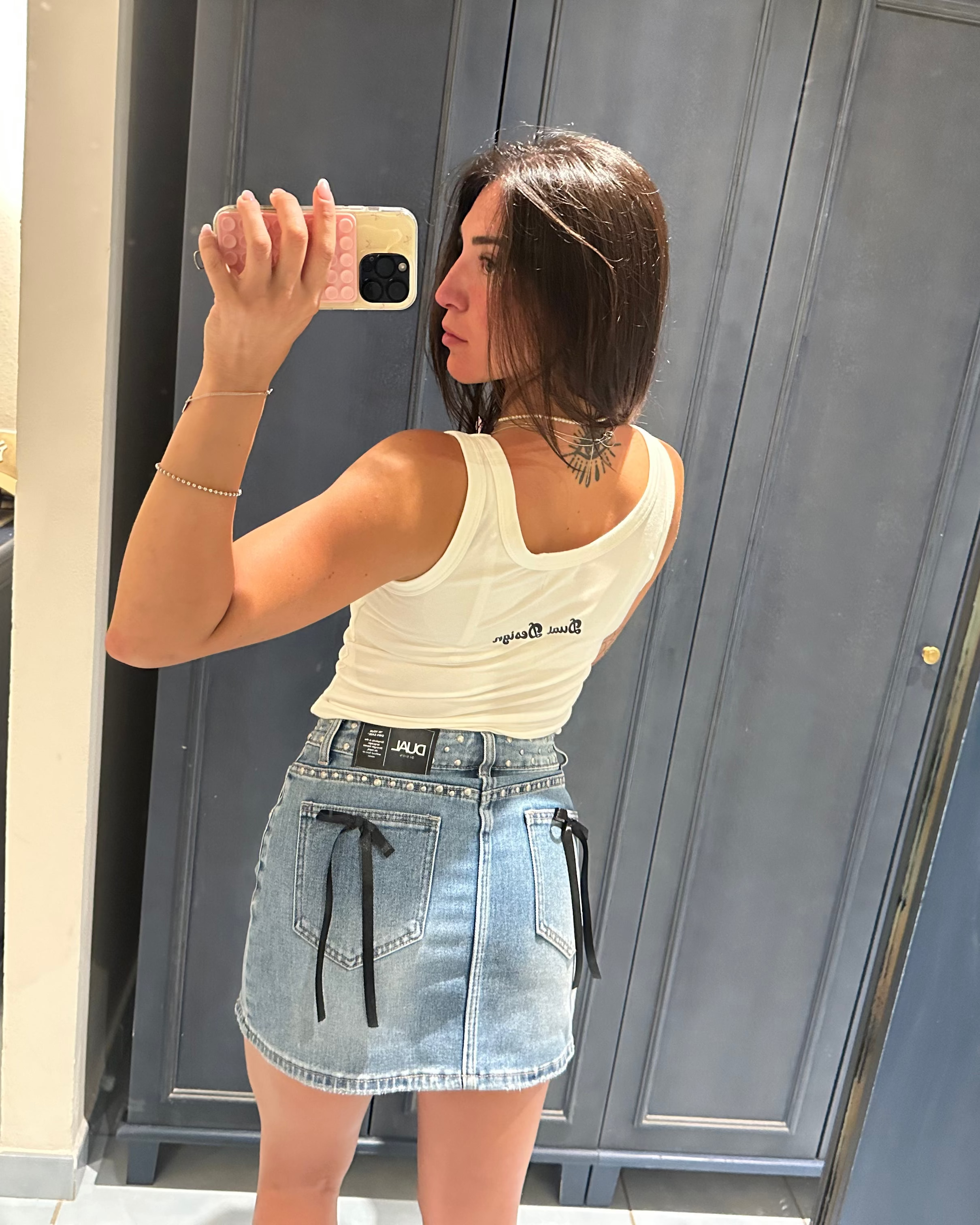 gonna denim jeans con fiocchi neri